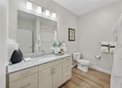 Thumbnail 14 of 23 - A bathroom with a white towel hanging on the towel rack.