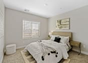 Thumbnail 23 of 23 - A bedroom with a large bed and a painting on the wall.