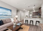 Thumbnail 15 of 40 - Living Area With Kitchen View at Decatur Landing I & II, Brooklyn Park, MN 55445