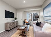 Thumbnail 5 of 40 - Living Room With TV at Decatur Landing I & II, Brooklyn Park