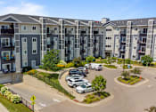 Thumbnail 27 of 33 - an aerial view of an apartment complex with cars parked in a parking lot at EastGate Apartments, Rochester, Minnesota