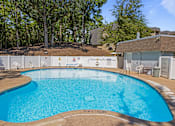 Thumbnail 18 of 32 - our resort style swimming pool is in front of our house with trees at Heritage Hills Apartments, Bloomington Minnesota