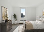 Thumbnail 11 of 21 - a bedroom with a bed and a dresser and a window at Humboldt Senior 55+ Apartments, Saint Paul, Minnesota