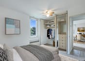 Thumbnail 4 of 21 - a bedroom with a bed and a closet at Humboldt Senior 55+ Apartments, Minnesota