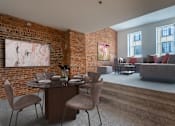 Thumbnail 10 of 21 - a living room with a brick wall and a table and chairs at Parkside Apartments, St. Paul, 55101