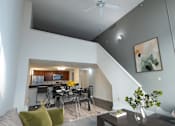 Thumbnail 7 of 21 - a living room with a dining room table and a kitchen at Parkside Apartments, St. Paul, Minnesota