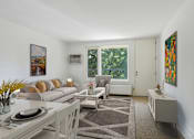 Thumbnail 7 of 21 - a living room with a couch and a table and a window at Humboldt Senior 55+ Apartments, Saint Paul