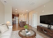 Thumbnail 11 of 27 - Living Room With TV at The Quill 55+ Apartments, Hastings, Minnesota