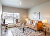 Thumbnail 7 of 51 - an open living room with a couch and a window at Technology Park Apartments, Minnesota, 55901
