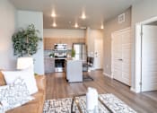 Thumbnail 1 of 51 - a living room and kitchen with a couch and a table at Technology Park Apartments, Rochester, Minnesota