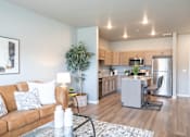 Thumbnail 2 of 51 - a living room and kitchen with a couch and a table at Technology Park Apartments, Rochester, 55901