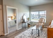 Thumbnail 8 of 51 - an open living room with a bedroom in the background at Technology Park Apartments, Rochester, 55901