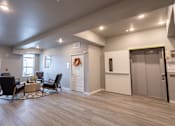Thumbnail 22 of 51 - the clubhouse at the champion apartments has a living room and kitchen at Technology Park Apartments, Rochester, MN