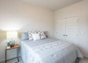 Thumbnail 44 of 51 - a white bedroom with a white bed and a white closet at Technology Park Apartments, Rochester, 55901