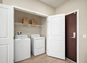Thumbnail 16 of 44 - A laundry room with a washer and dryer in it at The Winslow 62+ Apartments, West St Paul, MN
