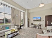 Thumbnail 41 of 44 - a living room with a couch and a table with chairs at The Winslow 62+ Apartments, West St Paul, 55118