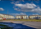 Thumbnail 1 of 57 - a row of houses on the side of a road