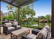 Thumbnail 28 of 49 - a patio with furniture and a view of a river