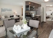 Thumbnail 3 of 28 - one plus den model, upgraded kitchen with slate cabinetry, vinyl flooring, dining area