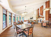 Thumbnail 26 of 49 - a large room with tables and chairs and windows