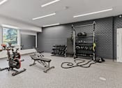 Thumbnail 60 of 83 - a spacious fitness center with exercise equipment and weights at Audenn Apartments, Bloomington, Minnesota