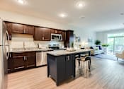 Thumbnail 64 of 82 - beautiful kitchen with granite and stainless steel appliances at Lake Jonathan Flats, Chaska, 55318