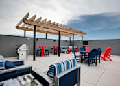 Thumbnail 58 of 82 - rooftop outdoor patio with firepit, grills and seating at Lake Jonathan Flats, Chaska, MN, 55318