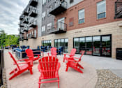 Thumbnail 53 of 82 - Outdoor patio with grilling and seating at Lake Jonathan Flats, Chaska