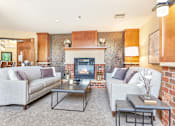 Thumbnail 23 of 49 - a living room with couches and a fireplace