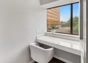 Thumbnail 39 of 53 - a room with a large window and a white chair