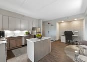 Thumbnail 9 of 53 - a kitchen and dining area in a 555 waverly unit