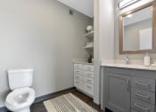 Thumbnail 12 of 53 - a bathroom with a toilet sink and mirror