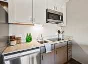 Thumbnail 4 of 53 - Fully Equipped Kitchen at Aire MSP Apartments, Bloomington