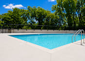 Thumbnail 13 of 88 - A rectangular pool with a metal ladder on the side.