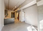 Thumbnail 32 of 65 - A spacious bathroom with a large mirror and a sink at Ardor on the Bluffs South Loop Residences Apartments, Minnesota, 55425