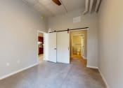 Thumbnail 34 of 65 - A room with a white door and a white wall at Ardor on the Bluffs South Loop Residences Apartments, Bloomington, 55425