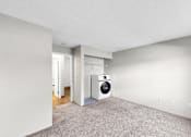 Thumbnail 17 of 83 - A room with a washing machine in it.