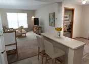 Thumbnail 15 of 34 - a view of the living room from the kitchen  at Briarcliff Apartments, a 55+ Community, Mahtomedi, MN, 55115
