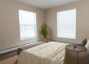 Thumbnail 9 of 34 - a bedroom with two windows and a large bed  at Briarcliff Apartments, a 55+ Community, Minnesota, 55115