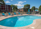 Thumbnail 18 of 28 - outdoor pool with sundeck and lounge chairs