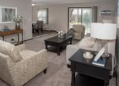 Thumbnail 2 of 28 - one plus den model, living room with view of balcony and dining area