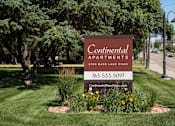 Thumbnail 28 of 28 - A sign for Continental Apartments is displayed in a landscaped area.
