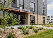Thumbnail 59 of 61 - A modern building with the word "COOPER" on the entrance.