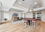 Thumbnail 8 of 61 - A modern dining room with a round table and chairs.