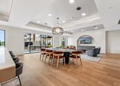 Thumbnail 3 of 61 - A modern dining room with a wooden table and chairs.