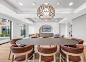Thumbnail 7 of 61 - A modern dining room with a large table and chairs.