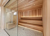 Thumbnail 24 of 61 - A room with wooden walls and a glass door.