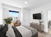 Thumbnail 42 of 61 - A modern bedroom with a large bed and a flat-screen TV mounted on the wall.