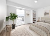Thumbnail 29 of 61 - A bedroom with a large bed and a potted plant.