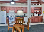 Thumbnail 3 of 29 - community room kitchen